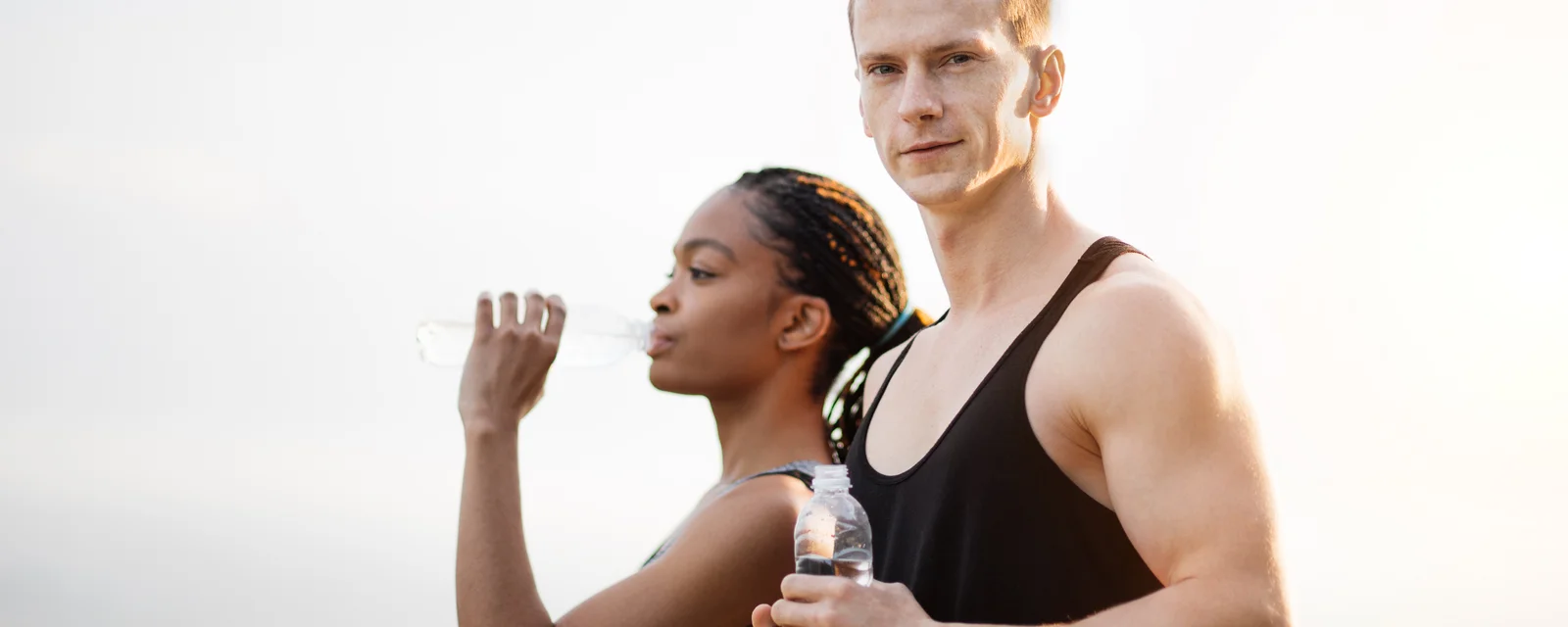 Young couple drinking fresh water